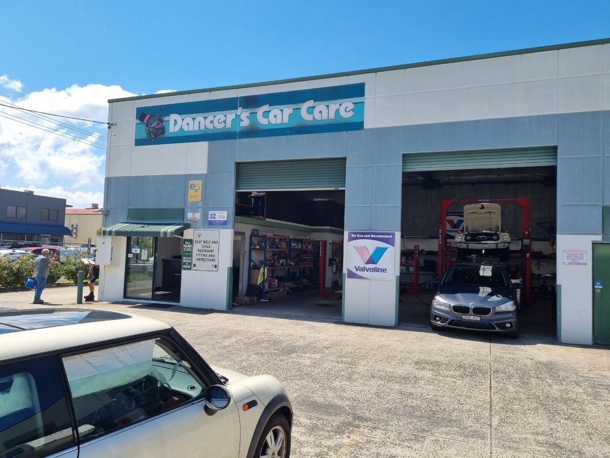 A Car Is Parked In Front Of A Car Care Shop — Dancers Car Care In Ballina, NSW