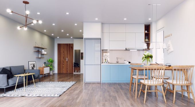 a living room with a couch , table , chairs and a kitchen .