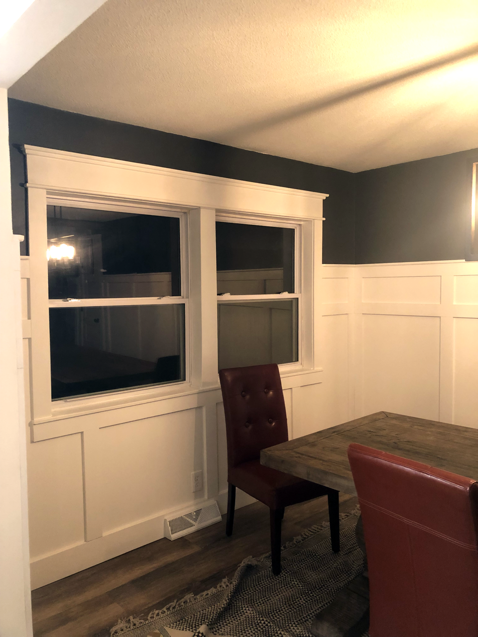 A Dining Room With White Custom Millwork on the Walls. Built by Hombs Custom Homes in Mid-Mo.
