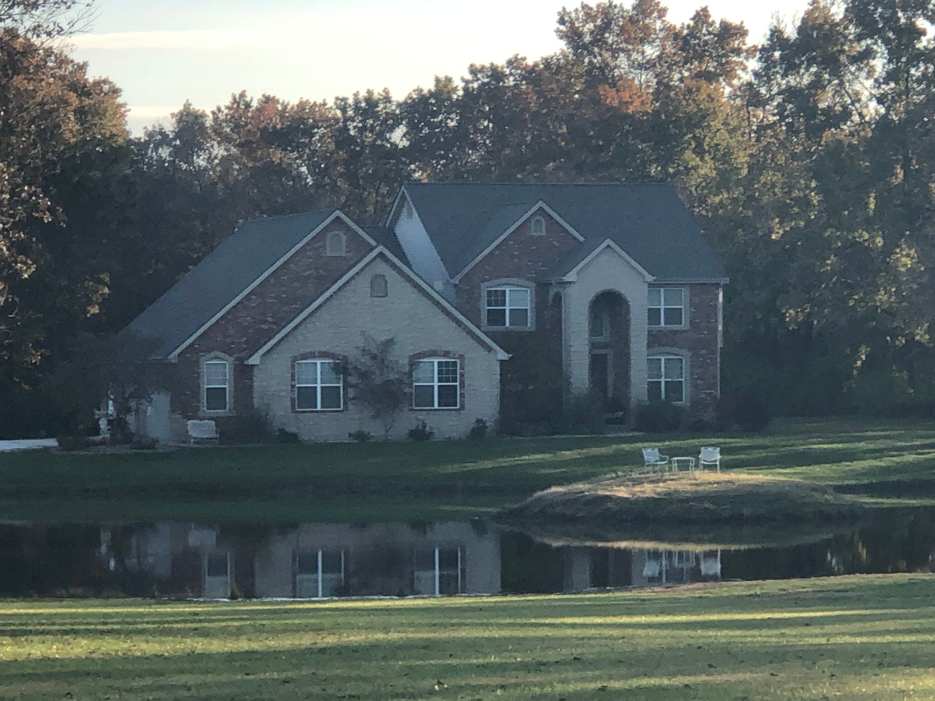 A Custom Built Home Built by a Lake. Call Hombs Custom Homes to Build Your Dream Home in Mid-Mo.
