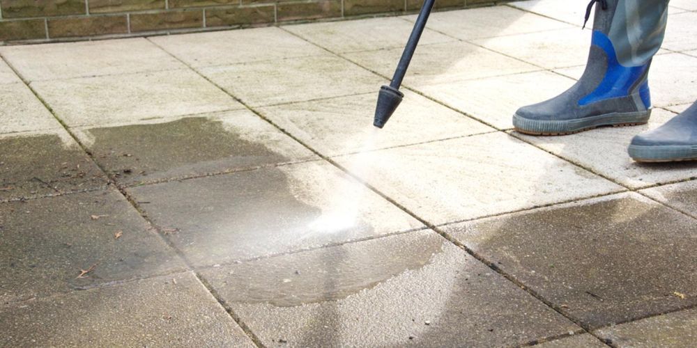 spray-the-patio-with-a-hose