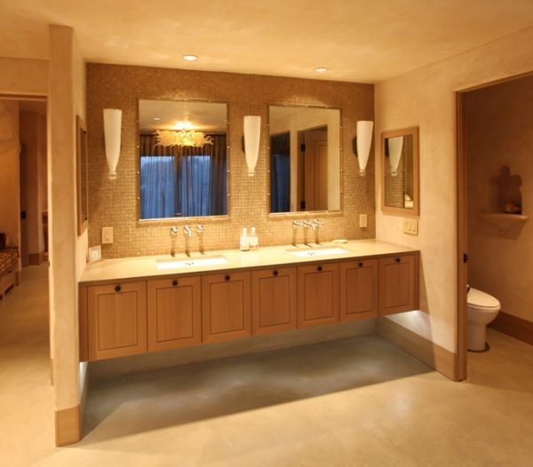 A bathroom with two sinks and three mirrors
