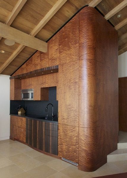 A kitchen with wooden cabinets and stainless steel appliances