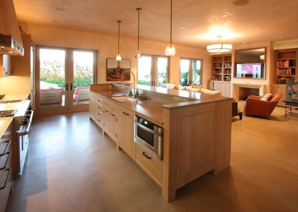A kitchen with a large island in the middle of it