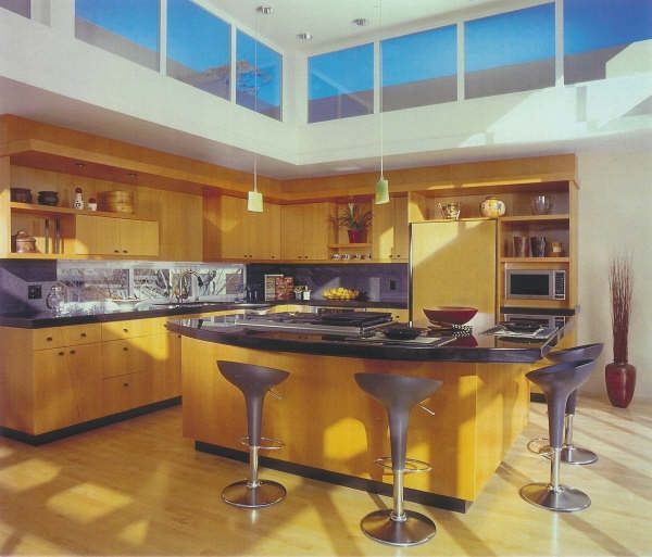 A kitchen with a large island and stools