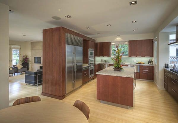 A kitchen with stainless steel appliances and wooden cabinets