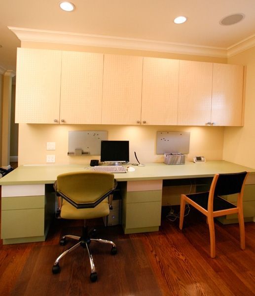 A desk with a chair and a computer on it