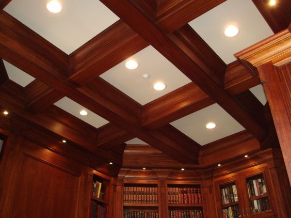 A library with a wooden ceiling and lots of books
