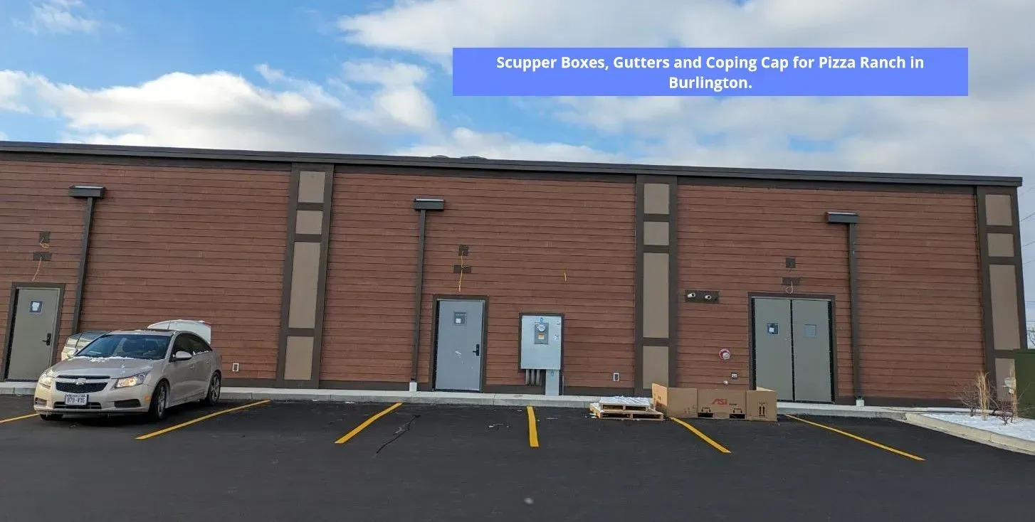 Exterior of a brick building with several doors and a parked car. Text reads Exterior of a brick building with several doors and a parked car.