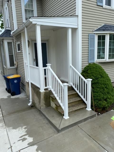 A house with a white porch and stairs