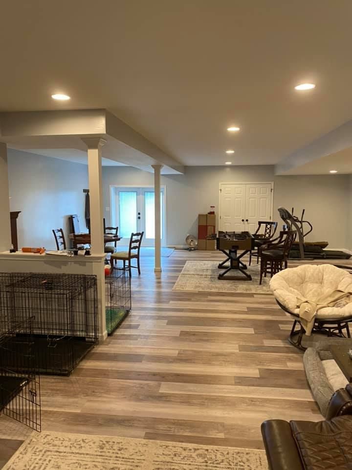 There is a dog cage in the middle of the room.