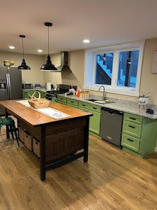 There is a large island in the middle of the kitchen.