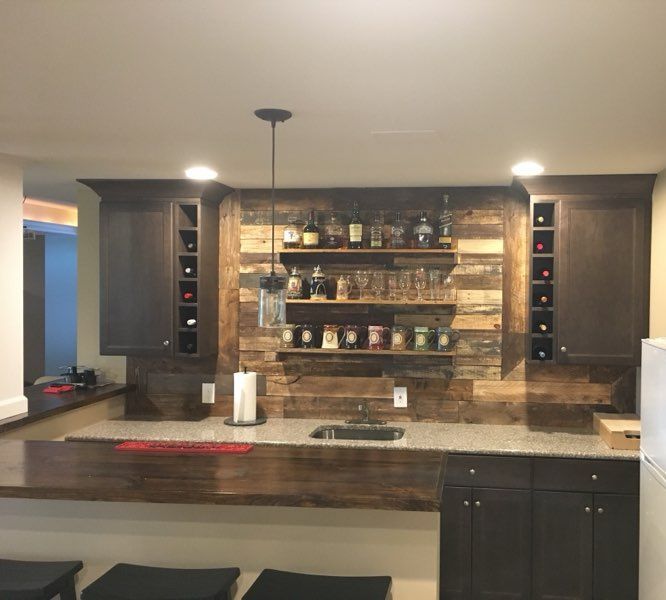 A large kitchen with a dining table and chairs in it.