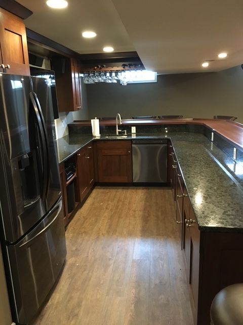 A kitchen with stainless steel appliances and granite counter tops