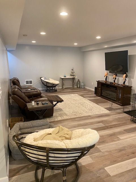 A living room filled with furniture and a flat screen tv.