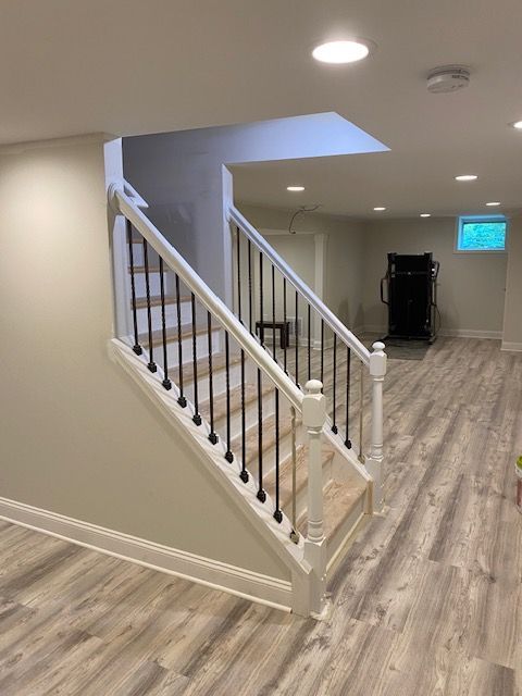 A basement with stairs leading up to the second floor
