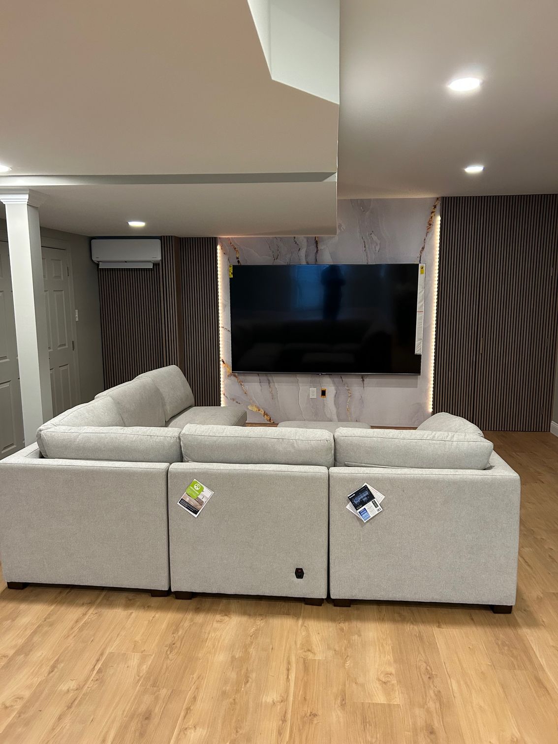 A living room with a couch and a flat screen tv.