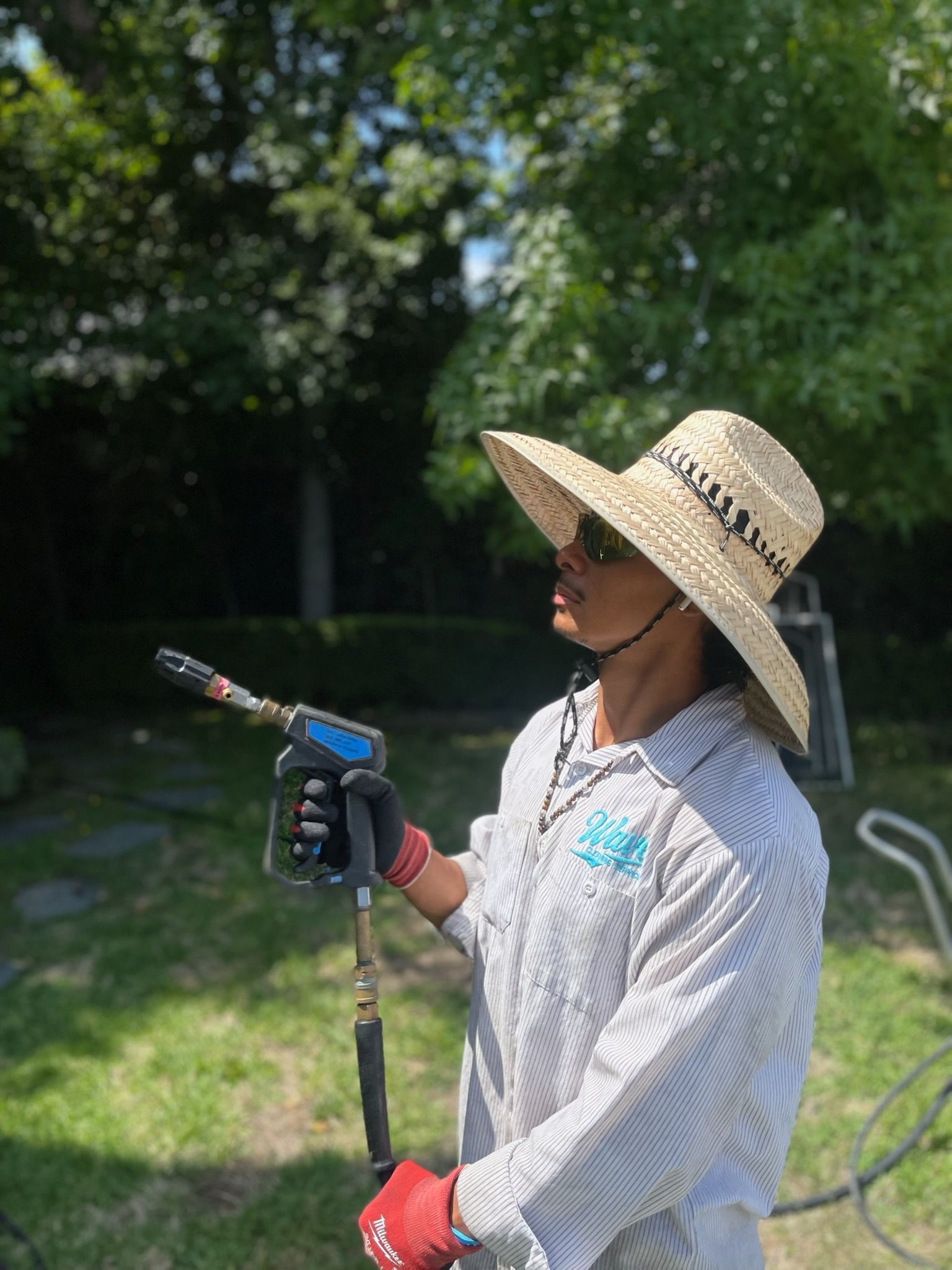 Pressure washer cleaning a concrete surface.