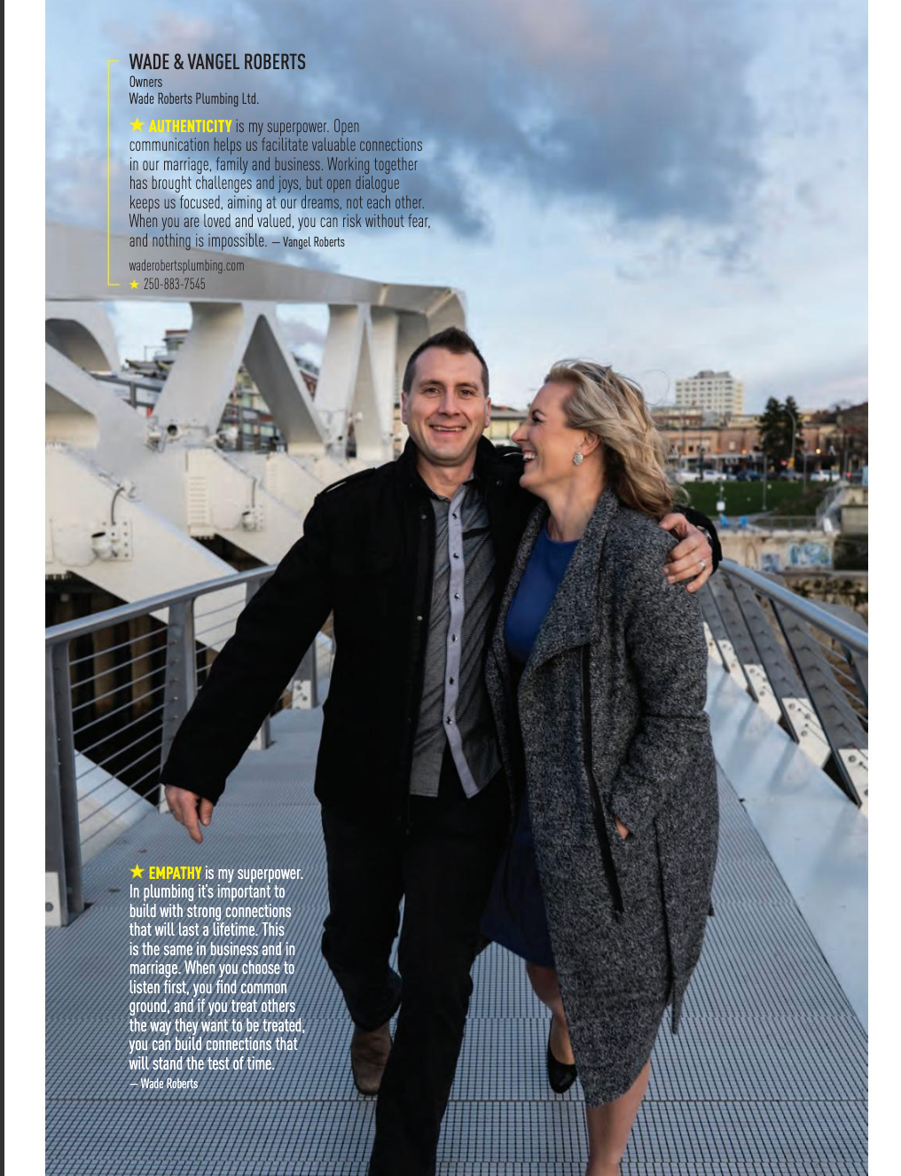 A man and a woman are walking on a bridge.