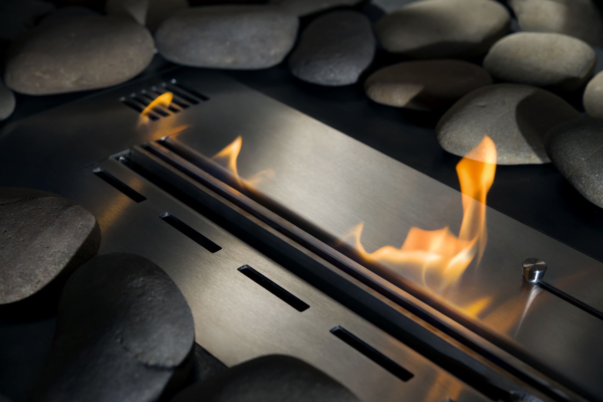 A fireplace with a lot of rocks in the background