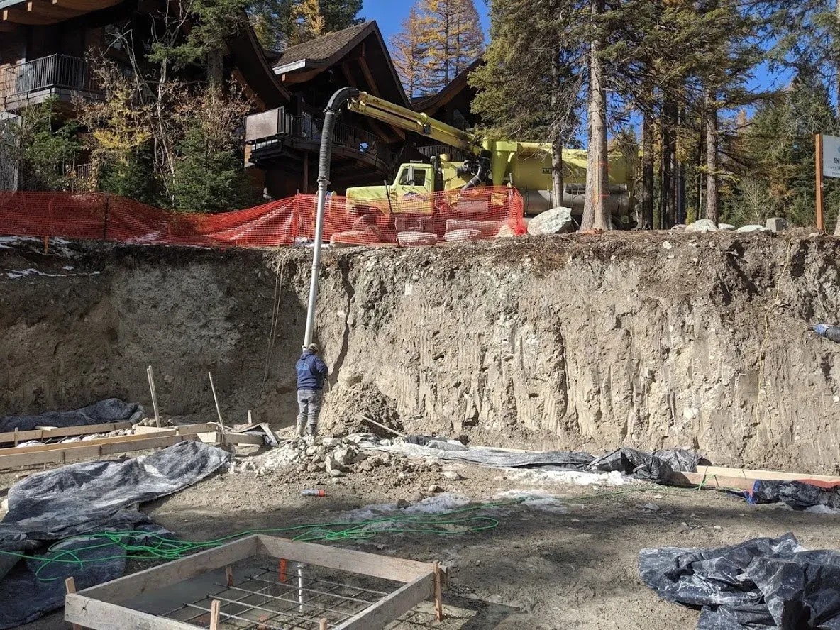 Man Standing On A Excavated Area — Kalispell, MT — A-1 Sanitation