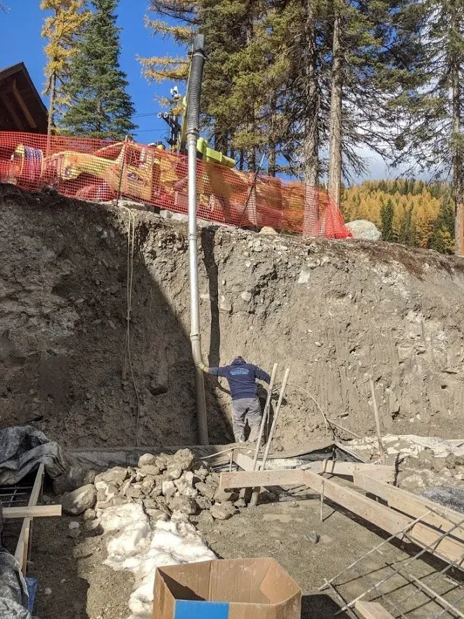 Man Guiding The Pipe — Kalispell, MT — A-1 Sanitation