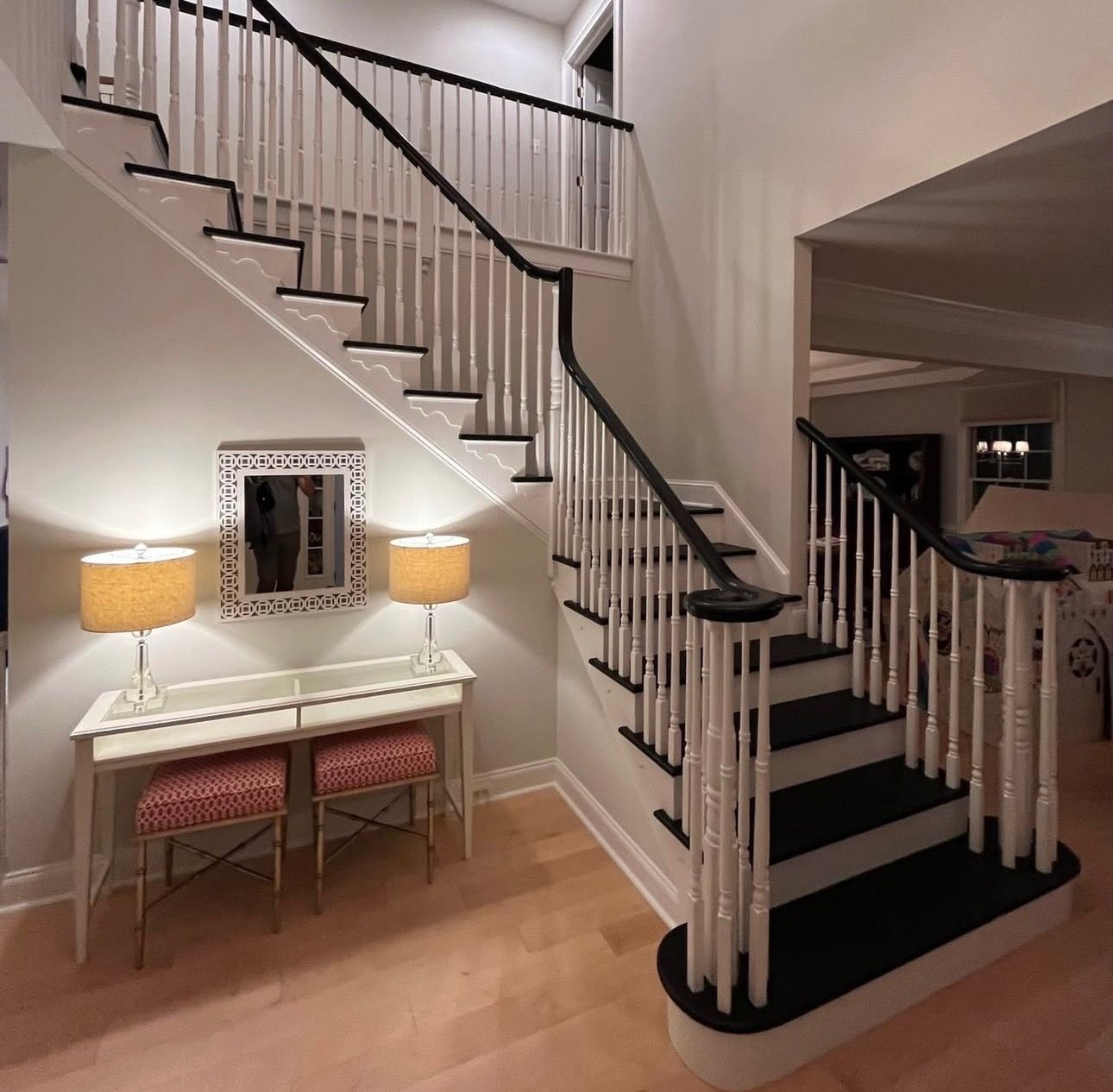 Porch ceiling with green and yellow stripes; light blue house with white trim.