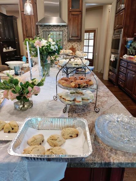 A kitchen counter with a tray of cookies on it.