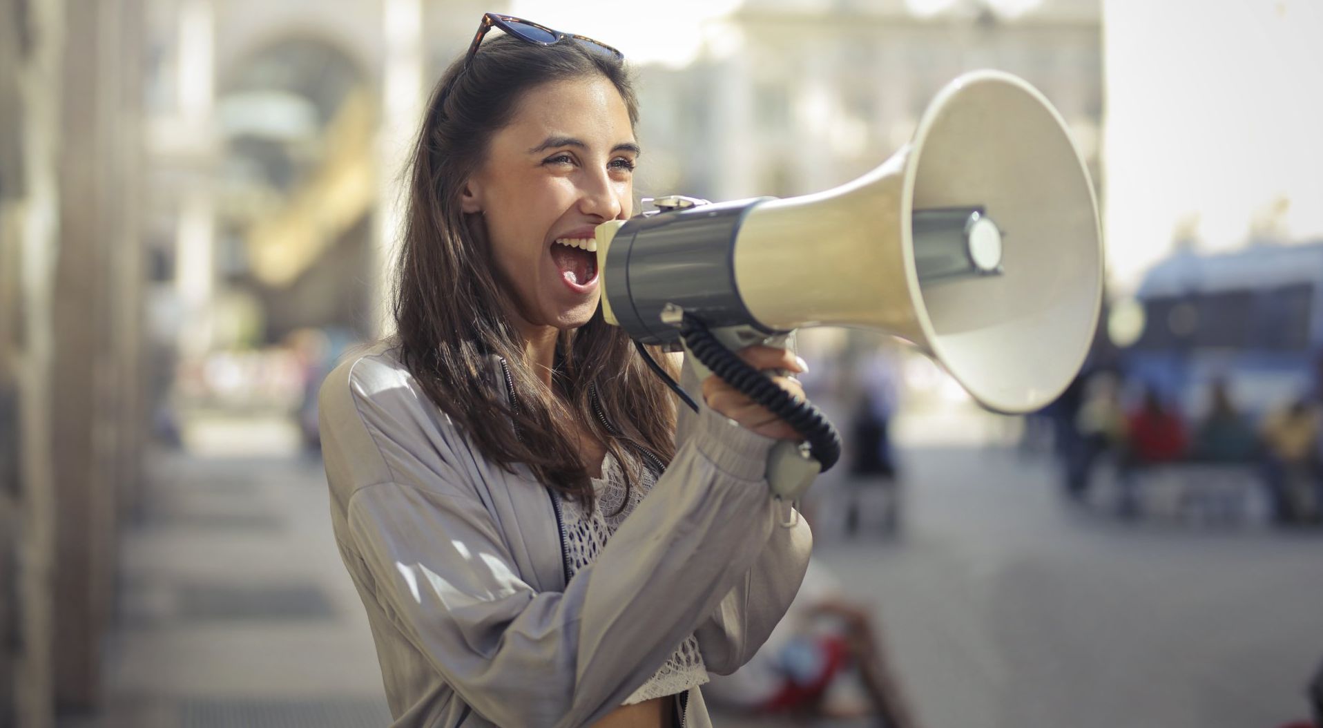Women with megaphone announcing why SEO is important