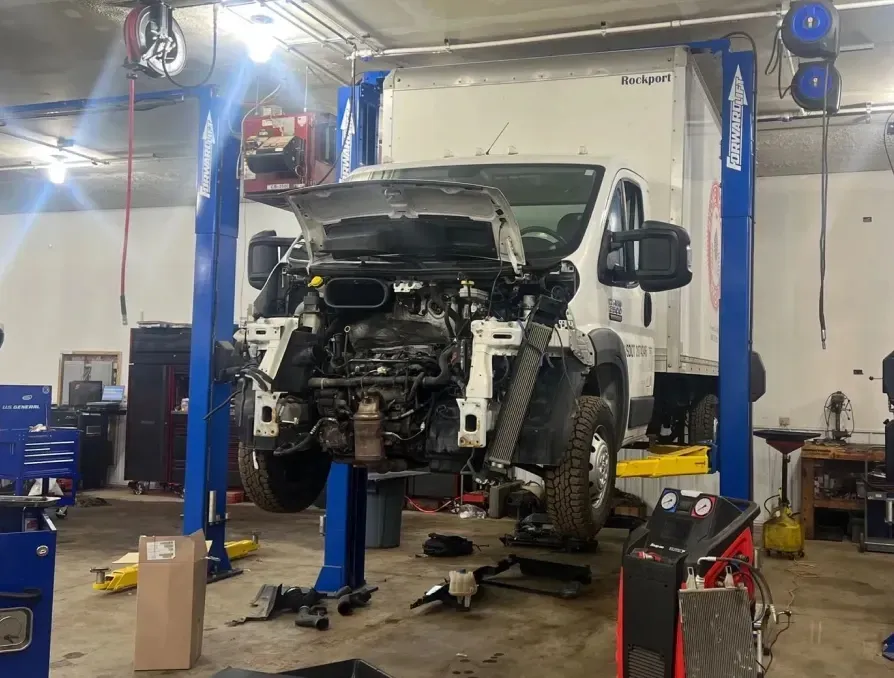 Truck raised up in garage | Key Diesel and Auto Service