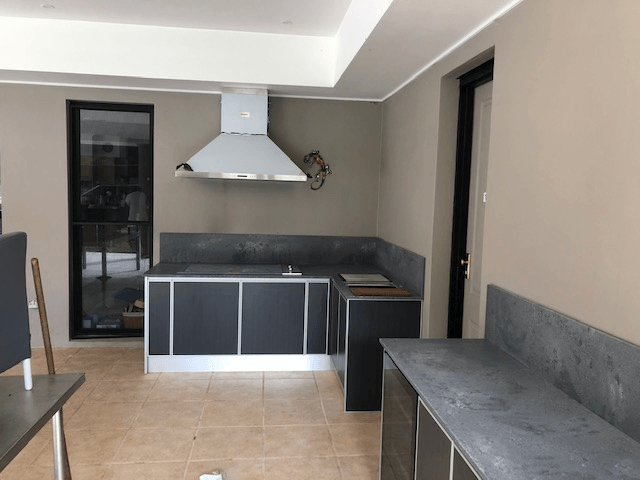 Outdoor Kitchen With Black Cabinets — Kitchen Design Experts in Central Coast, NSW