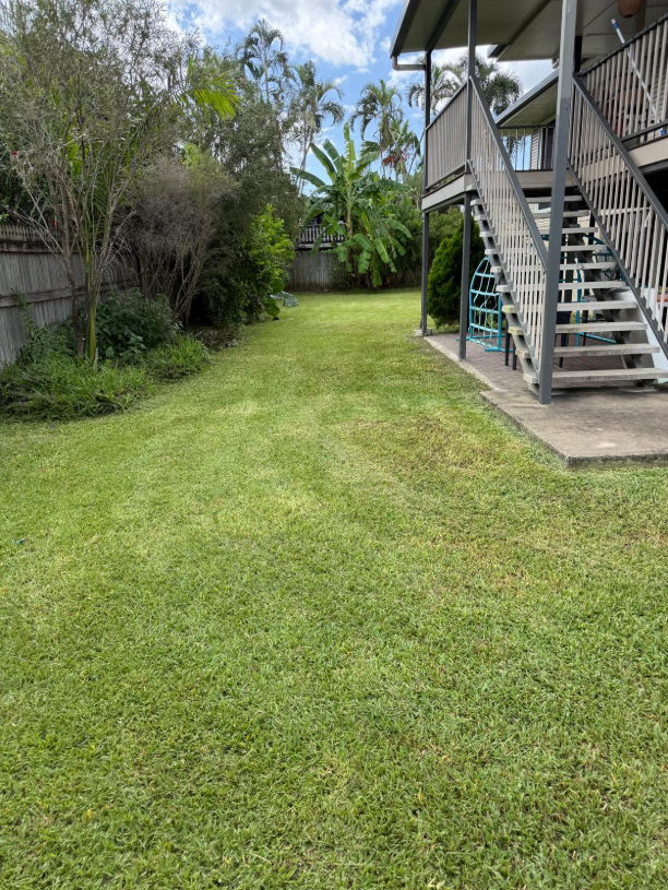 Man Blowing Leaves Near a Bp Gas Station — Hanta Mowing Services Townsville in Kirwan, QLD