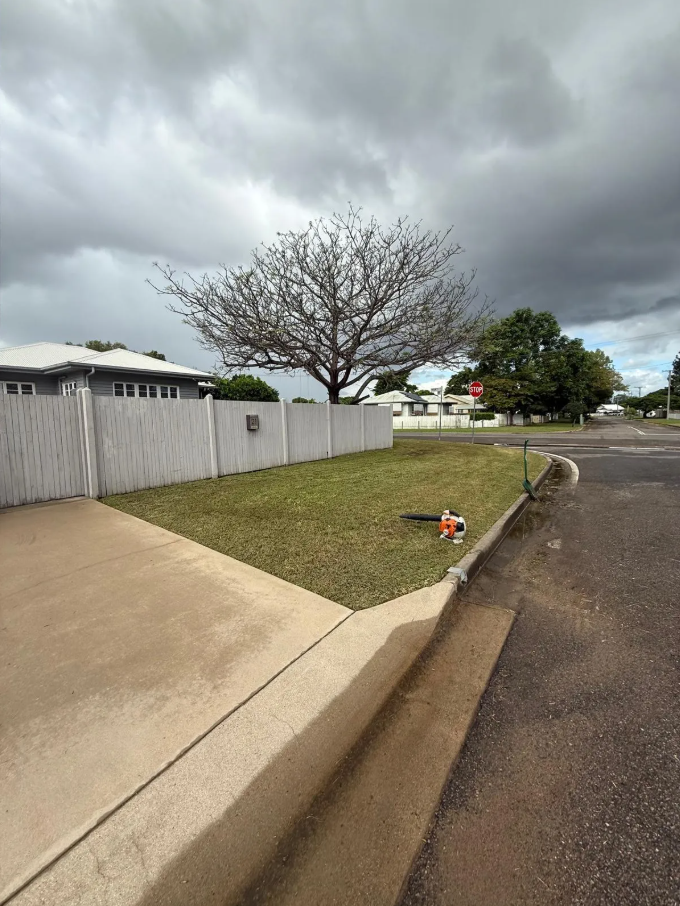 Man Mowing Grass With a Red Gravely Mower — Hanta Mowing Services Townsville in Kirwan, QLD