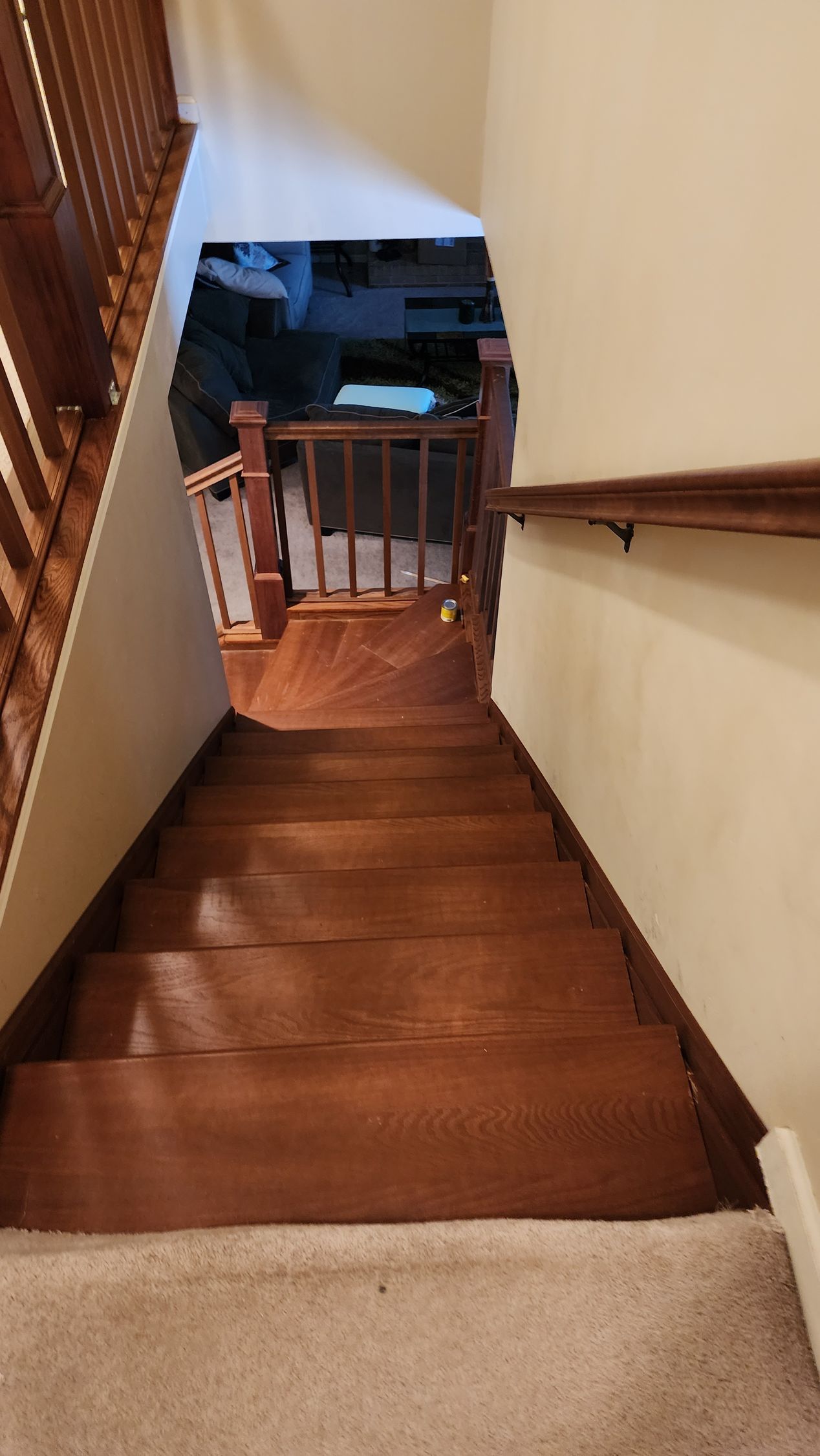A wooden staircase leading up to the second floor of a house | Champaign, IL | Unity Construction Inc.