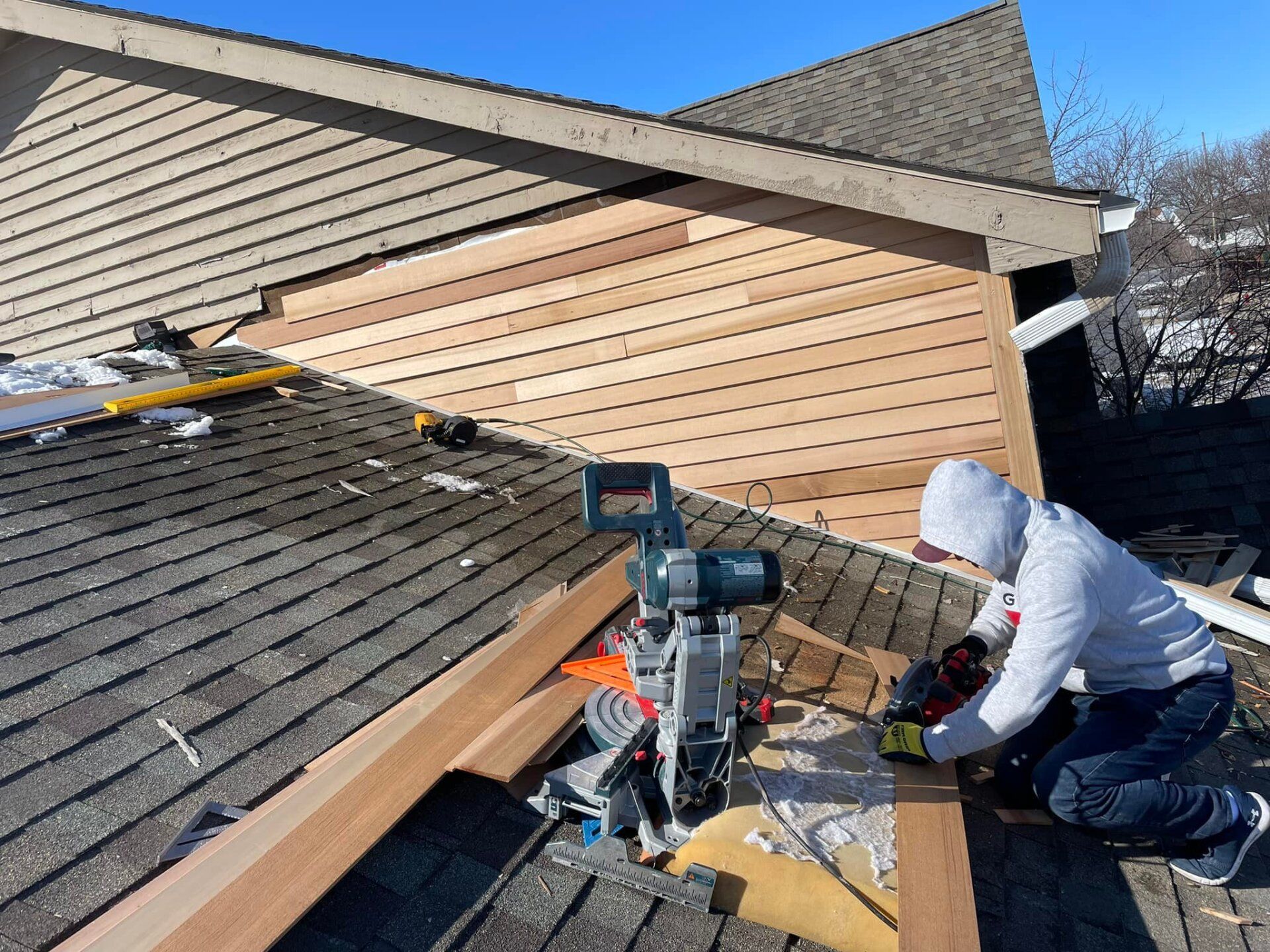 Man Fixing A Roof — Champaign, IL — Unity Construction Inc