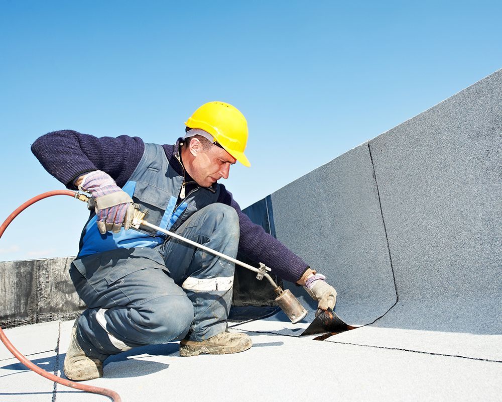 a Roofing Specialist from Unity Construction Inc., working in Champaign, IL