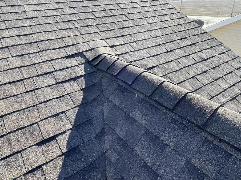 A close up of a roof with shingles on it.