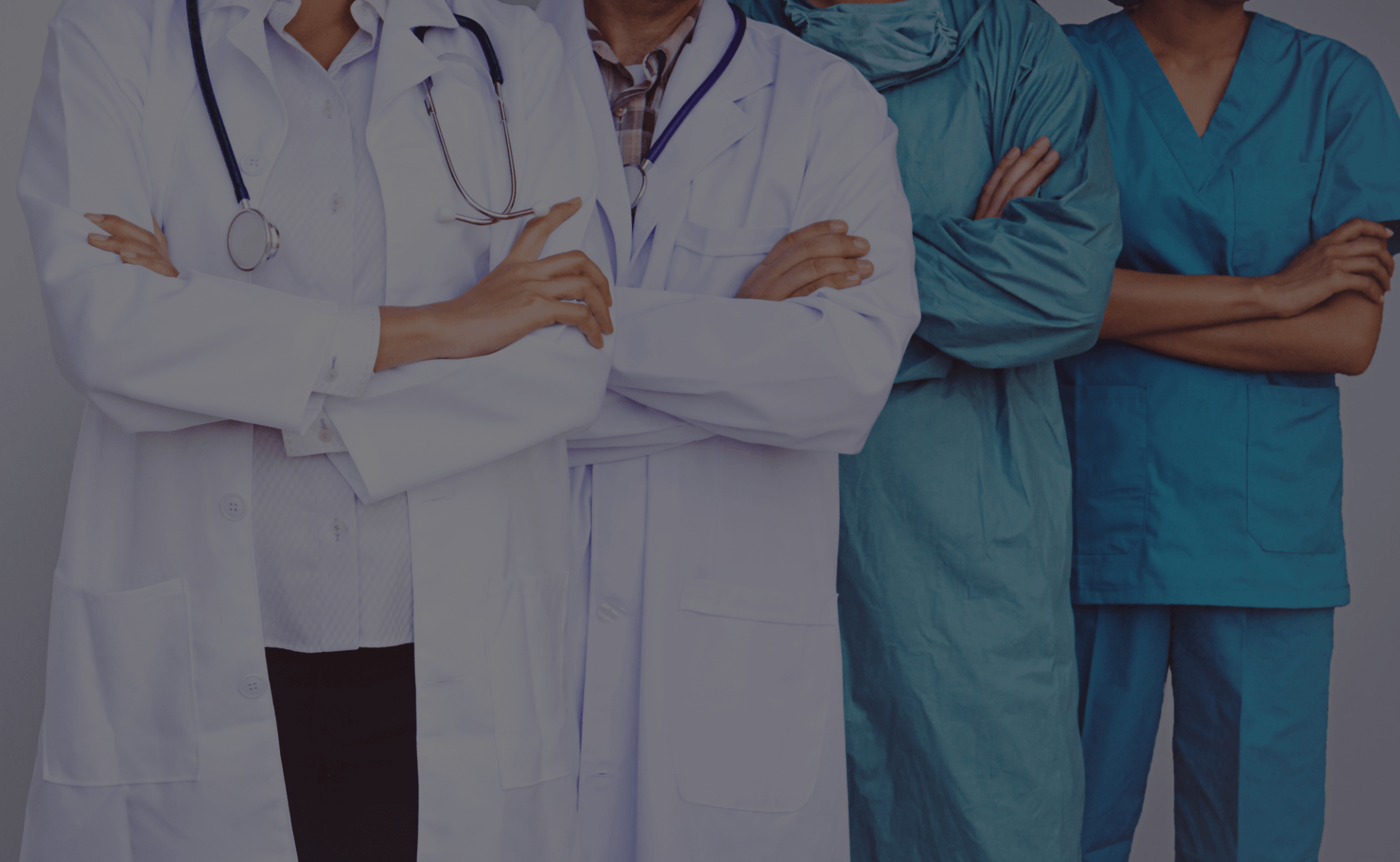 Doctors standing with arms folded