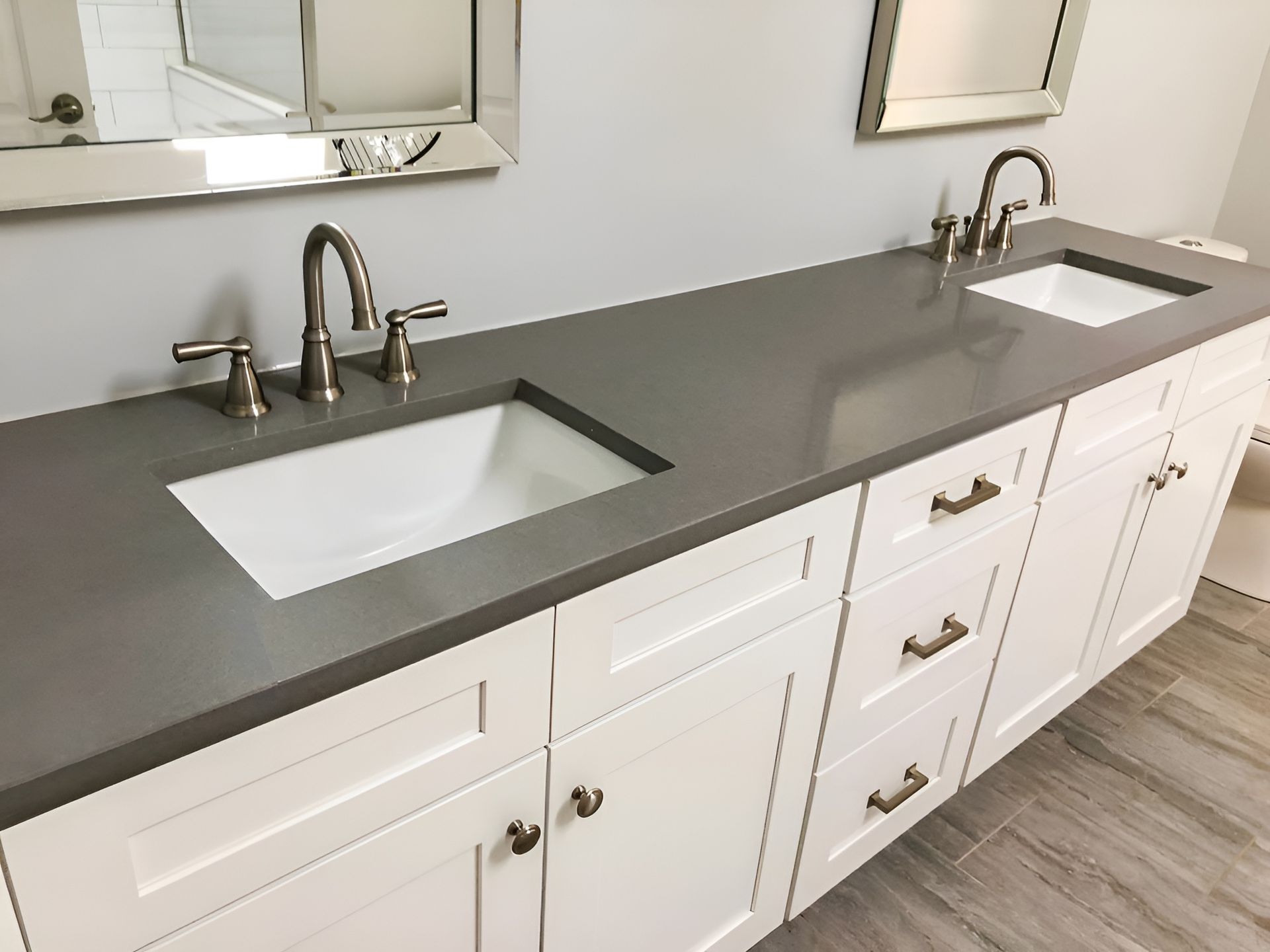 A Bathroom With Two Sinks and a Mirror — Mackay Cabinetmaking Service In Glenella, QLD
