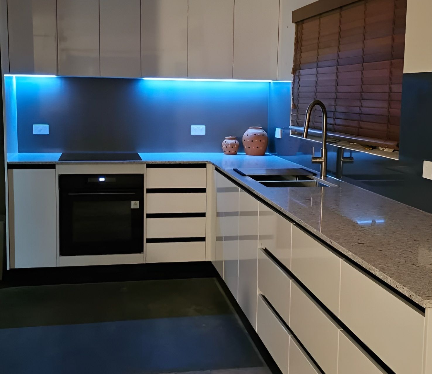 Modern Kitchen With White Cabinets — Mackay Cabinetmaking Service In Glenella, QLD