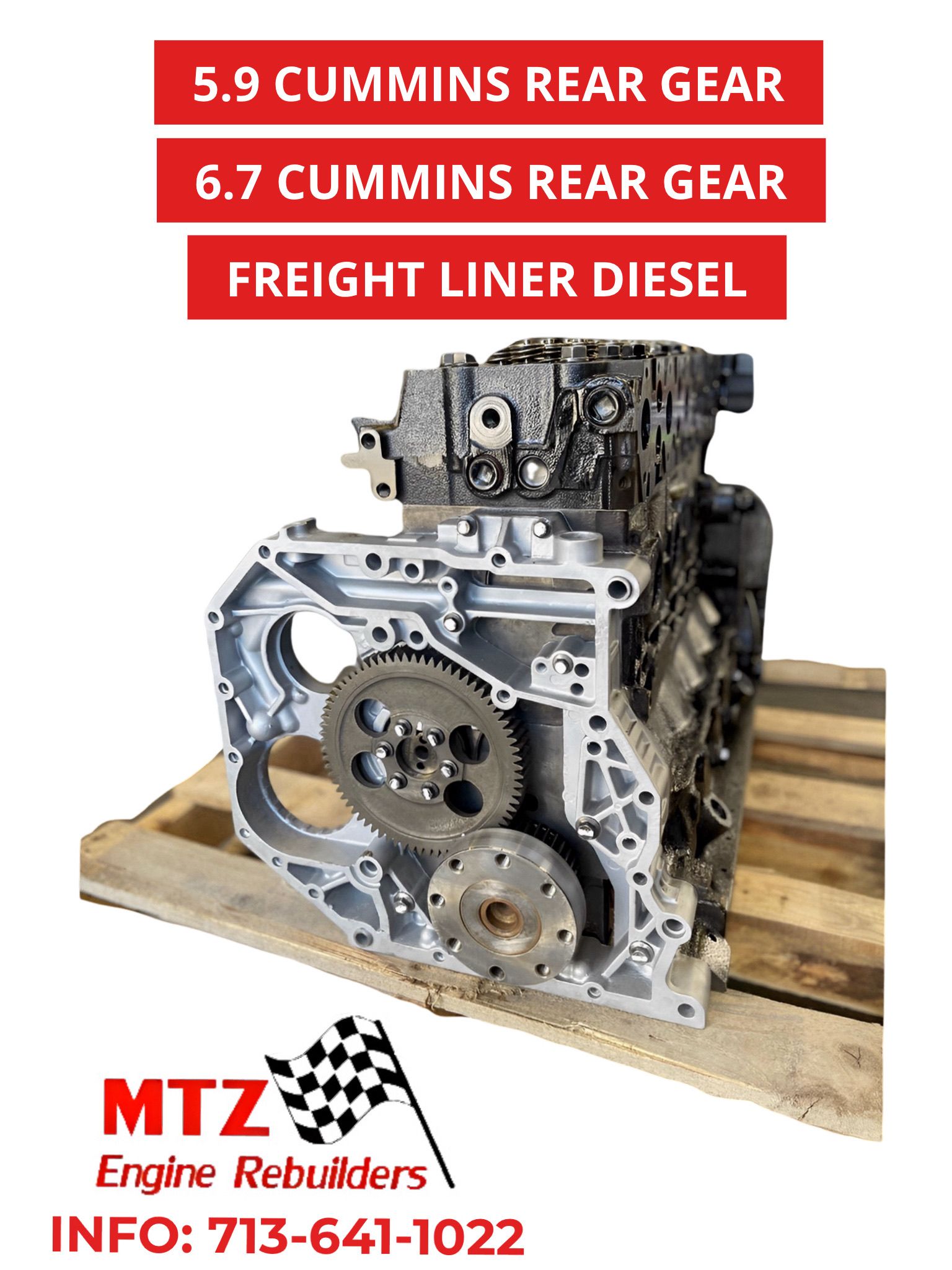 A cummins engine is sitting on a wooden pallet.