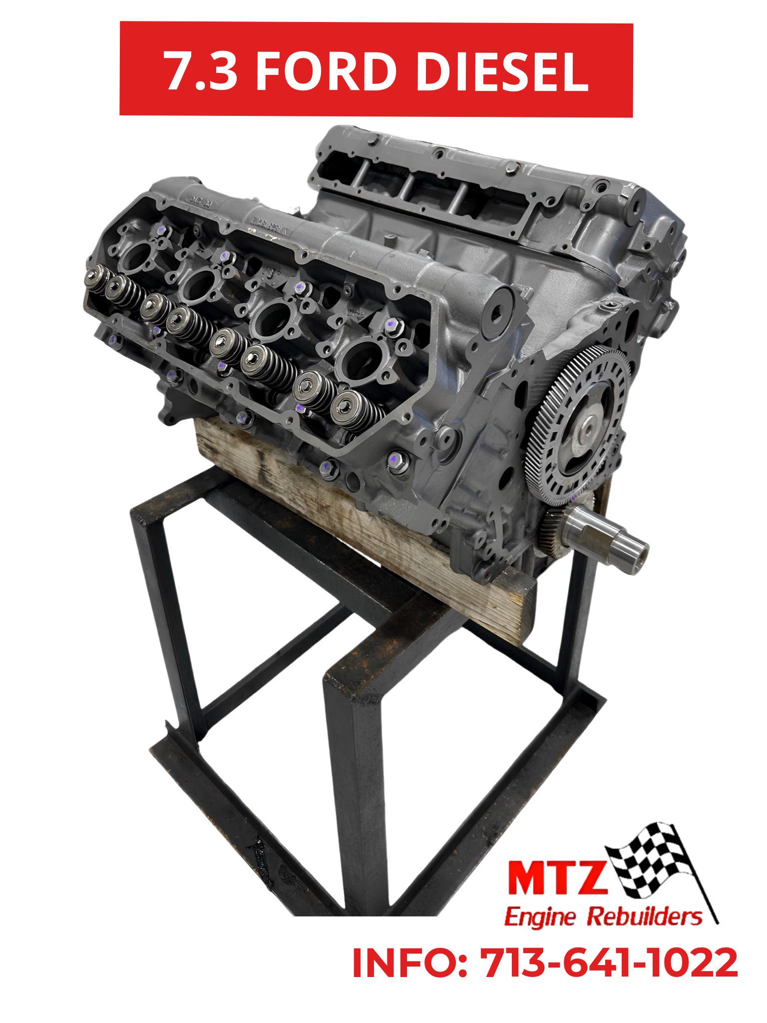 A 7.3 ford diesel engine is sitting on top of a metal stand.