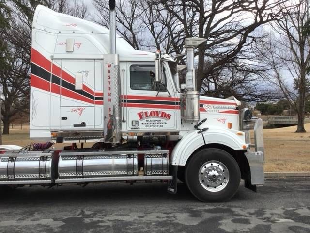 a floyds semi truck is parked in a parking lot