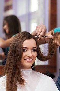 Affordable Hair Care — Girl Having A Haircut in Brunswick, ME