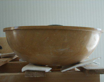 Wash basin in solid stone