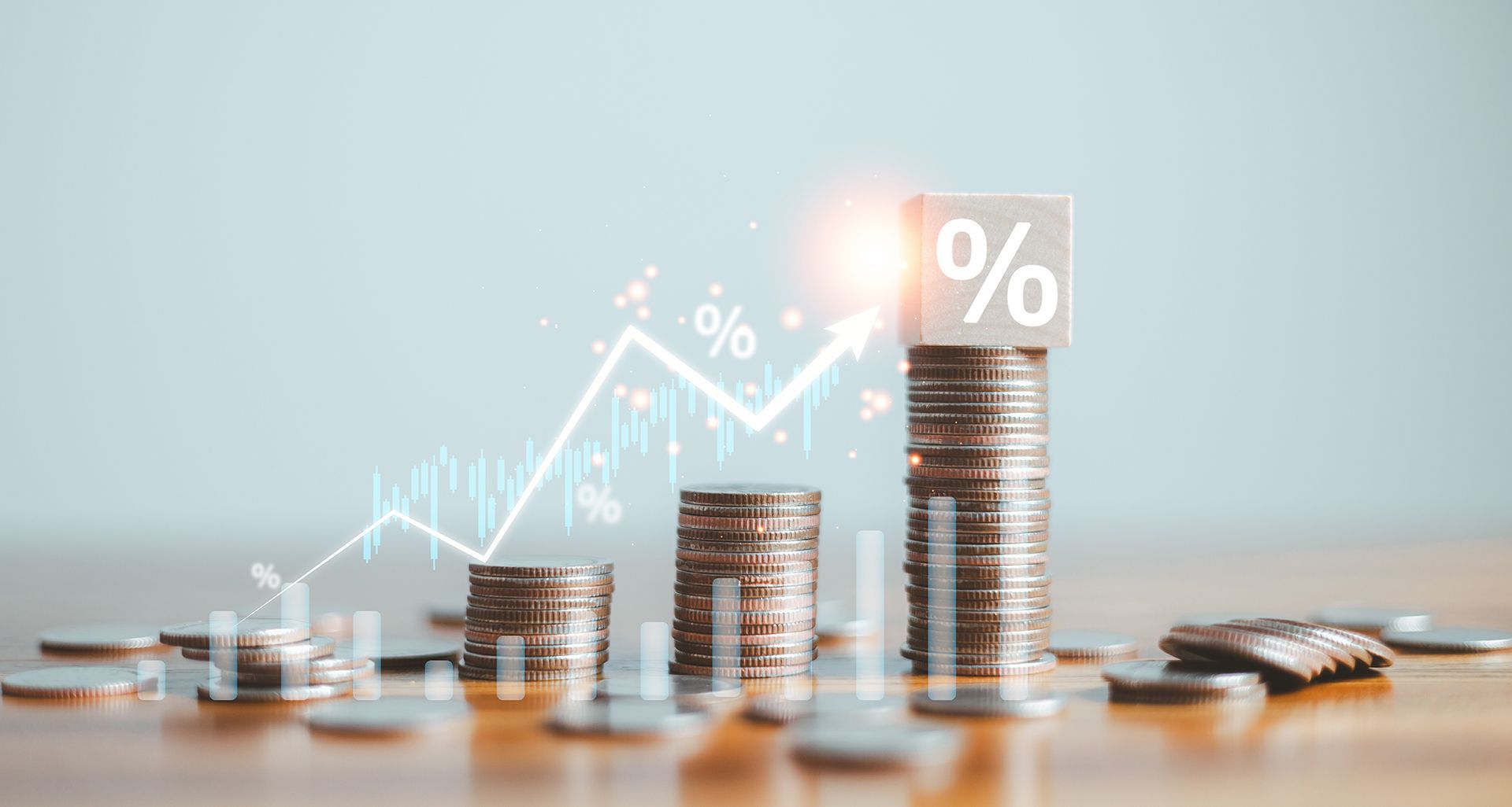 A stack of coins with a percentage sign on top of them.