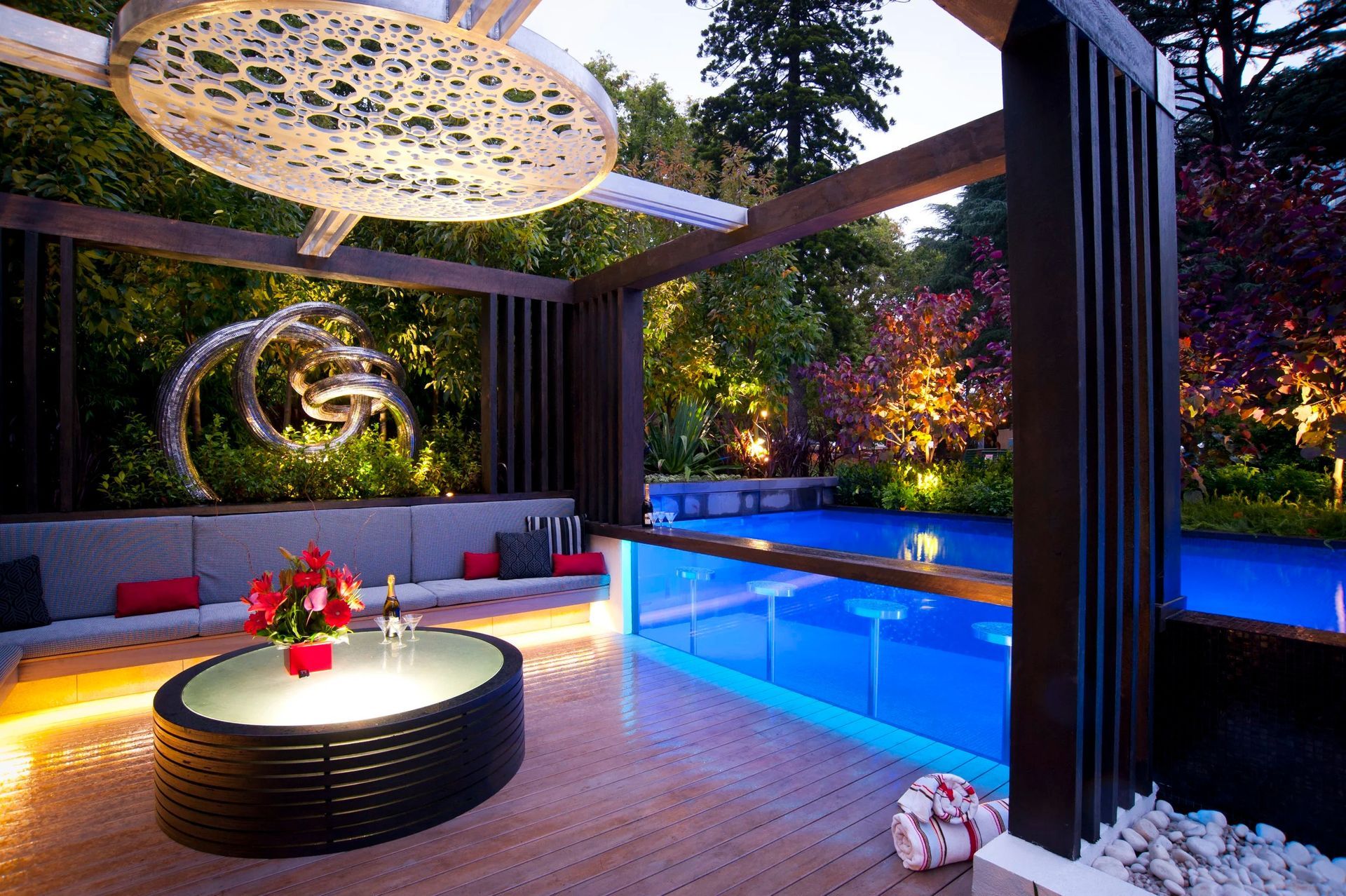 Outdoor Lounge Area With a Pool, Modern Design, and Ambient Lighting — Port Douglas Pool Shop in Craiglie, QLD