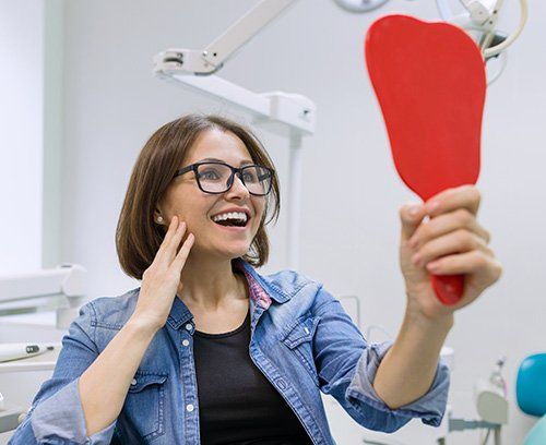 Woman smiling after receiving Conventional Dentures at Union Dental