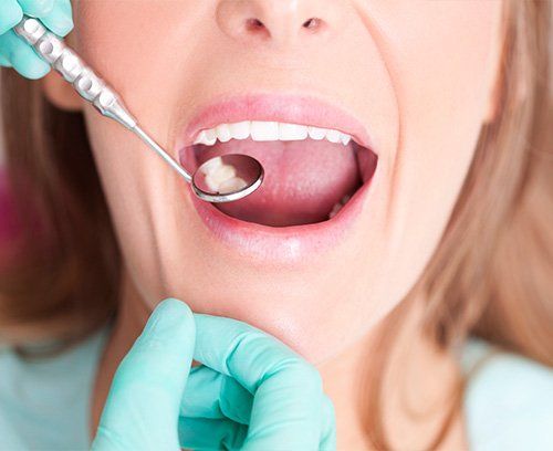 Woman recieving a dental exam at Union Dental Marlborough, MA