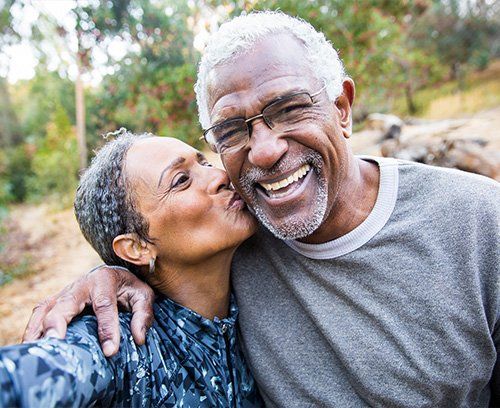 Elderly African American couple smiling